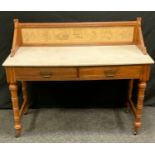 A late Victorian Aesthetic Movement oak marble topped washstand, the back inset with seven Minton