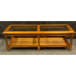 A 20th century oak coffee table, rectangular two panel bevelled glass top above a woven under