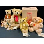 Steiff - a Steiff Classic 1909 jointed bear, red ribbon, 37cm long; another, smaller, 24cm high;
