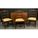 A set of three George III Revival dining chairs, 90cm high, 53cm wide, the seat 37cm deep; a 20th