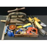 Tools - a Victorian cast iron book press; vintage oil can; another draper; clamps, hammers, glue