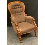 A Victorian mahogany spoonback nursing chair, button back upholstery, turned legs, 99cm high.