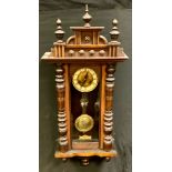 An early 20th century mahogany Vienna wall clock, 14.5cm circular dial, Roman numerals, turned