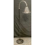 A mid 20th century black and chrome retro standard light, conical shade, the base with label, W.F.
