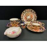 A Royal Crown Derby miniature coal scuttle, pattern 2649; a 2451 pattern teacup, saucer, side plate;