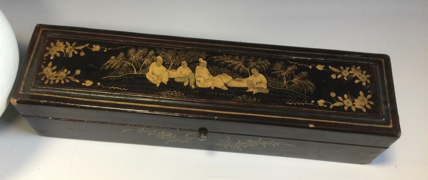 A Chinese papier mache rectangular fan box, decorated in gilt with Oriental figures and foliage, - Image 2 of 4