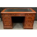 A Victorian mahogany pedestal desk, leatherette inlaid writing surface, molded top, one long and two