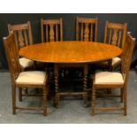 A set of six early/mid 20th century oak dining chairs, drop-in seats, barley twist supports; a