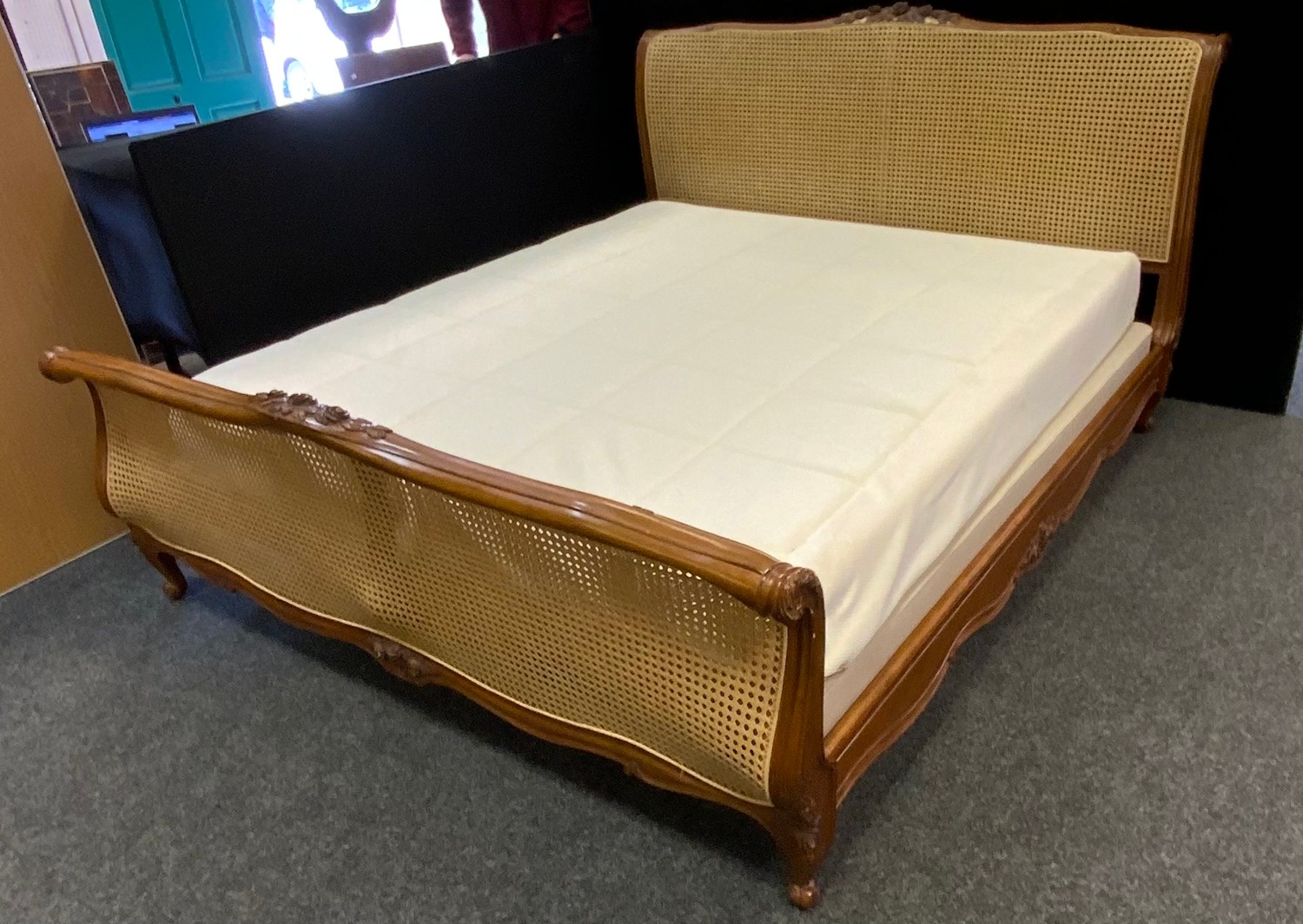 A Louis XV style king size bergere bed, by And so to bed London, 194cm wide, 226cm long, 114cm high;