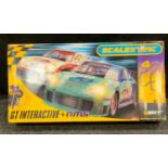 A Scalextric GT Interactive and RMS, with PorCshe 911 GT3R, nO77 and No.3