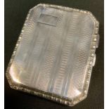A silver cigarette case, engine turned, 8.5cm long, Chester 1928, 2.3