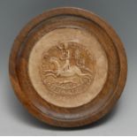 A museum-type cast impression, after a medieval seal, turned mahogany frame, 14.5cm diam overall