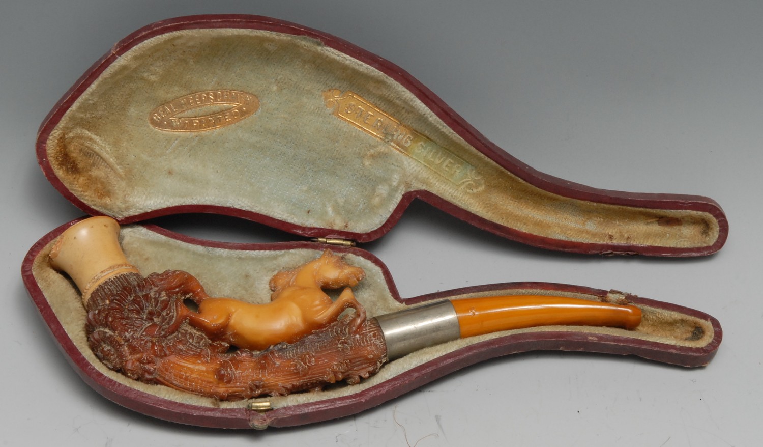 A late 19th century Meerschaum pipe, carved with a horse, amber mouthpiece, 17.5cm long, cased, c.