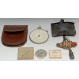 A Fowler's Twelve-Ten Patent Calculator, by Fowler & Co, Manchester, 9cm diam, leather case; a