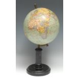 An early 20th century French terrestrial globe, by G. Thomas, Paris, ebonised stand, 38.5cm high