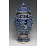A large Westerwald salt glazed stoneware pedestal tobacco jar, sprigged with heraldic devices,