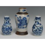 A small pair of Chinese porcelain baluster vases, applied with salamanders, painted in underglaze