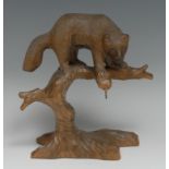 A Black Forest novelty pocket watch stand, carved as a bear upon the branches of a tree, 19cm high