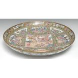 A large Chinese famille rose circular charger, typically with figures of the court, picked out in