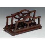 An unusual Edwardian mahogany table top canterbury periodical rack, shaped divisions, bun feet, 31.