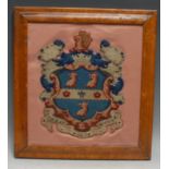 A 19th century Berlin woolwork armorial panel, depicting the arms and motto of Rugby School, on a