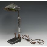 An Art Deco chromium-plated desk lamp, the shade decorated with sun rays through clouds, the base
