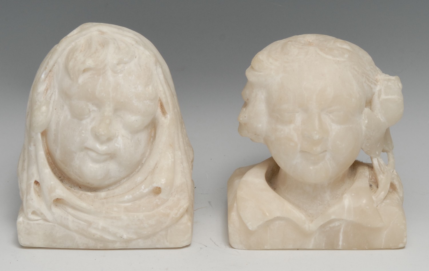 A 19th century alabaster carving, in the medieval taste as the head of monk, 13cm high; another,