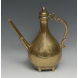 A Mughal Indian Islamic brass carnation ewer, hinged ogee cover, stylised zoomorphic handle,