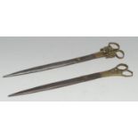 A pair of Middle Eastern Islamic steel and brass calligraphy scissors, the blades with traces of