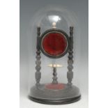 A 19th century ebonised pocket watch stand, turned supports and base, glass dome, 21cm high overall,