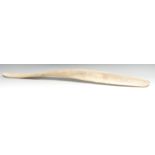 Tribal Art - an Inuit whale bone club, 87cm long