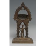 A 19th century Gothic Revival bronze pocket watch stand, cast with a knight beneath a tracery