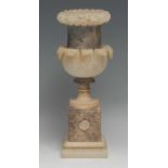 A 19th century alabaster campana mantel urn, carved and applied with bands of flowers and