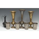 An Indian bidri fluted ovoid ewer, stylised cobra handle, 23cm high; a pair of vases, similar;
