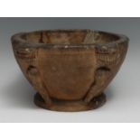Antiquities - a South East Asian terracotta mortar, possibly Indian, the projecting angles with