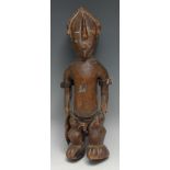 Tribal Art - a Yoruba Ibeji figure, navette-shaped face carved with stylized features, 36cm high,