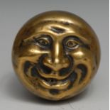 A brass novelty string box, as a comical face, 6.5cm high
