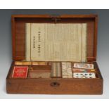 A late Victorian/Edwardian mahogany games compendium box, hinged cover enclosing an arrangement of