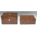 A Victorian walnut rectangular dressing box, hinged cover enclosing a mirror and an arrangement of
