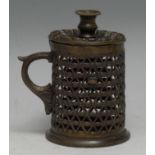 A post-Regency bronze bougie box/wax jack, campana sconce, lotus drip-pan, the cylindrical chamber