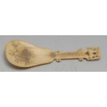 A Lapp or Sami reindeer bone spoon, the bowl scrimshaw engraved with a reindeer, 12cm long, 19th/