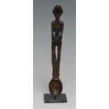 Tribal Art - an Ifugao figural spoon, the haft carved with a stylised bin-nullol figure, 15cm