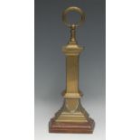 A 19th century brass country house door porter, ring terminal, stepped mahogany base, cast iron