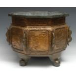 A substantial Chinese bronze octagonal censer, cast in relief with pagodas, landscapes and verse,