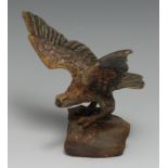 An Austrian cold painted bronze, of an eagle, perched on a rock with wings outstretched, 19cm wide