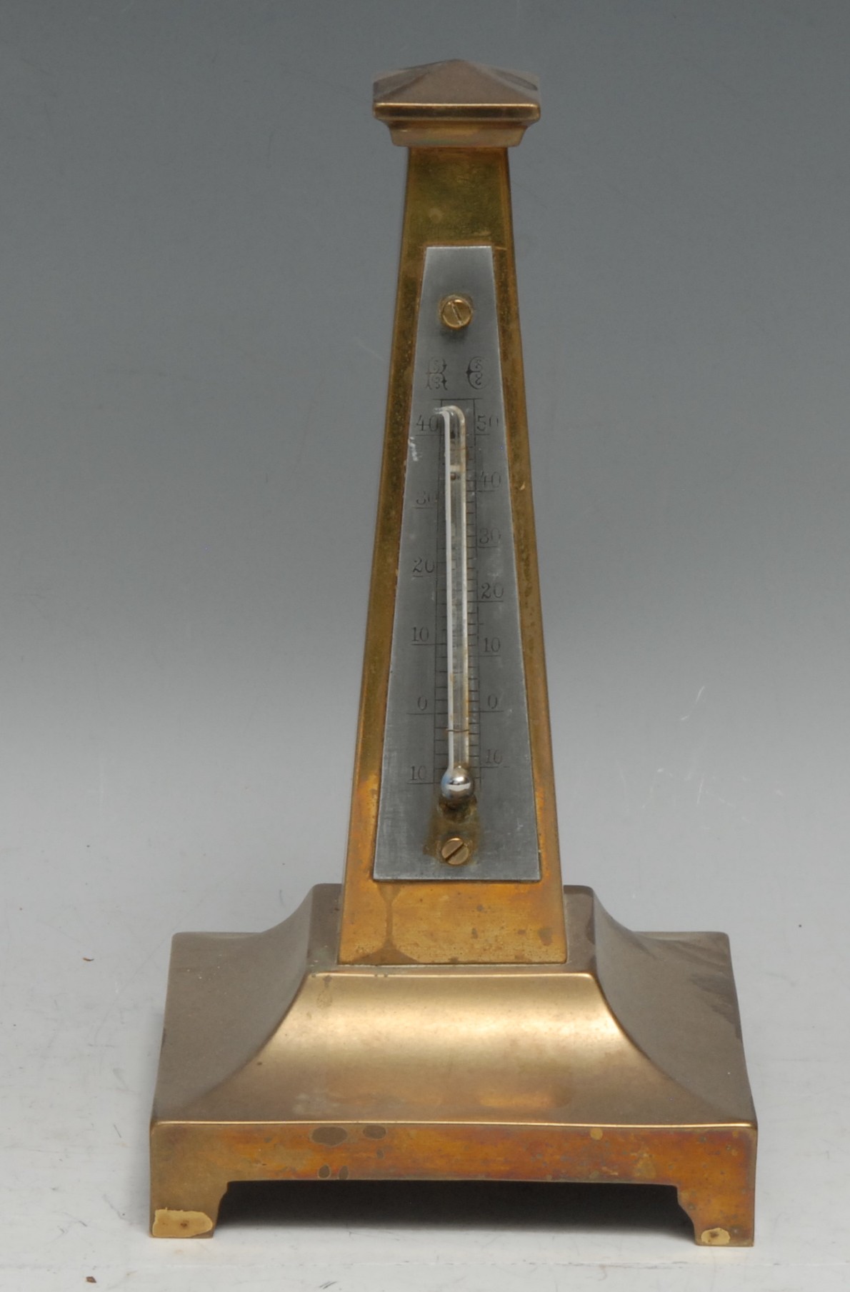 A 19th century cast brass obelisk desk thermometer, silvered register, bracket feet, 18.5cm high,