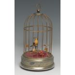 A novelty automaton, as a bird in a cage, 27cm high over handle, late 20th century