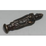 A South East Asian bronze votive or opium weight, cast as a deity, 7cm long