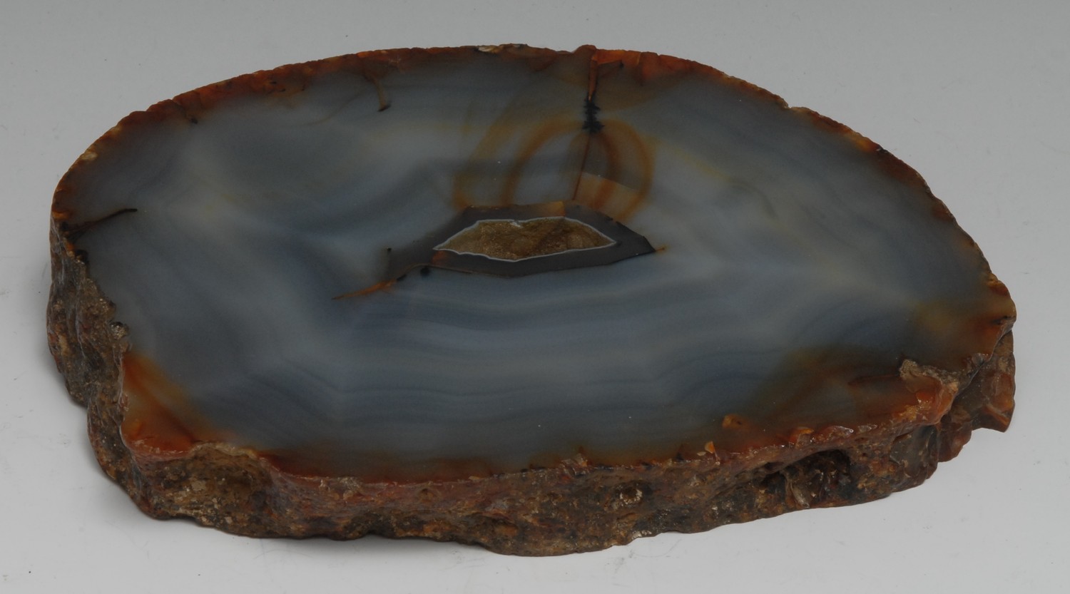 Geology - a transverse agate section, cut and polished to display matrix, 20cm wide