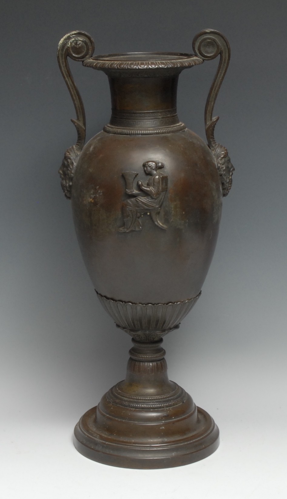 A 19th century Grecian Revival bronze and composition volute krater table urn, in the Grand Tour